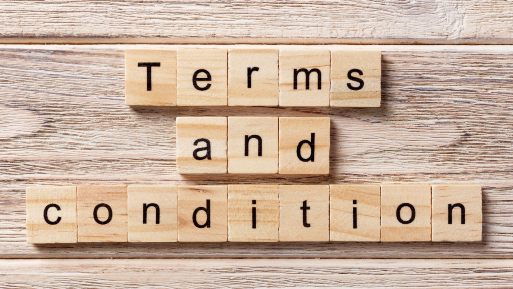 wooden scrabble pieces spelling out "terms and conditions"